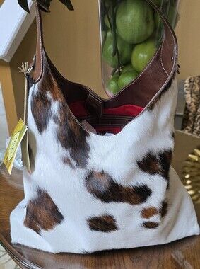 Cowhide Calvacanti Shoulder Tote in White and Chocolate Brown.